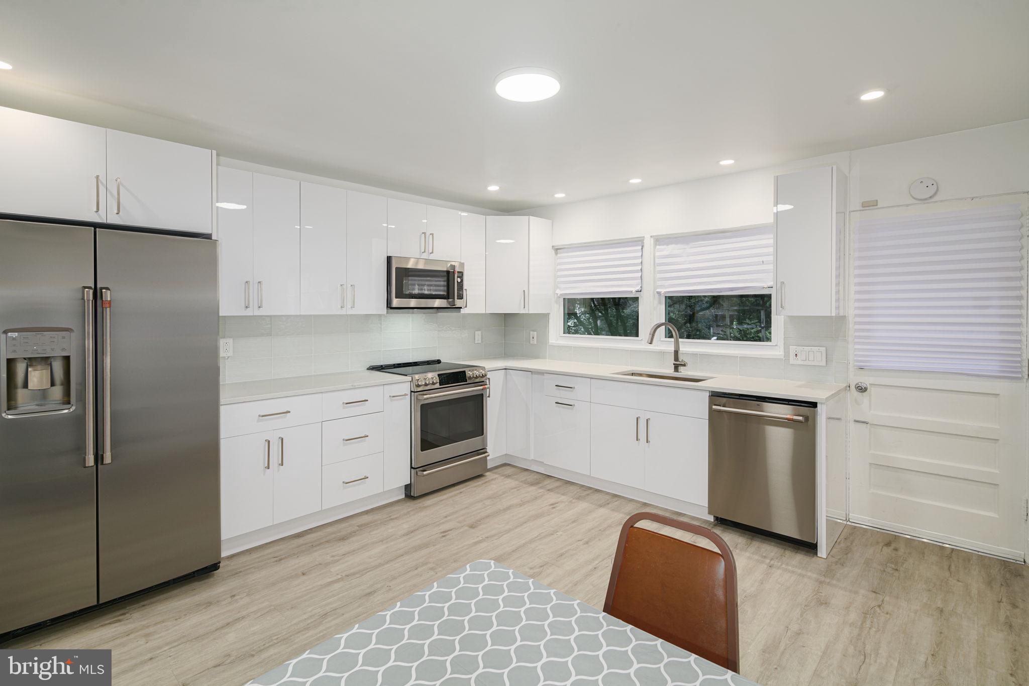 7908 Rolling Green Road Cheltenham, PA 19012 - Photo 5 of 35 New Kitchen with Quartz & Stainless Appliances