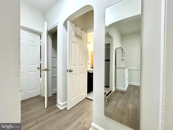 wooden floor with white walls