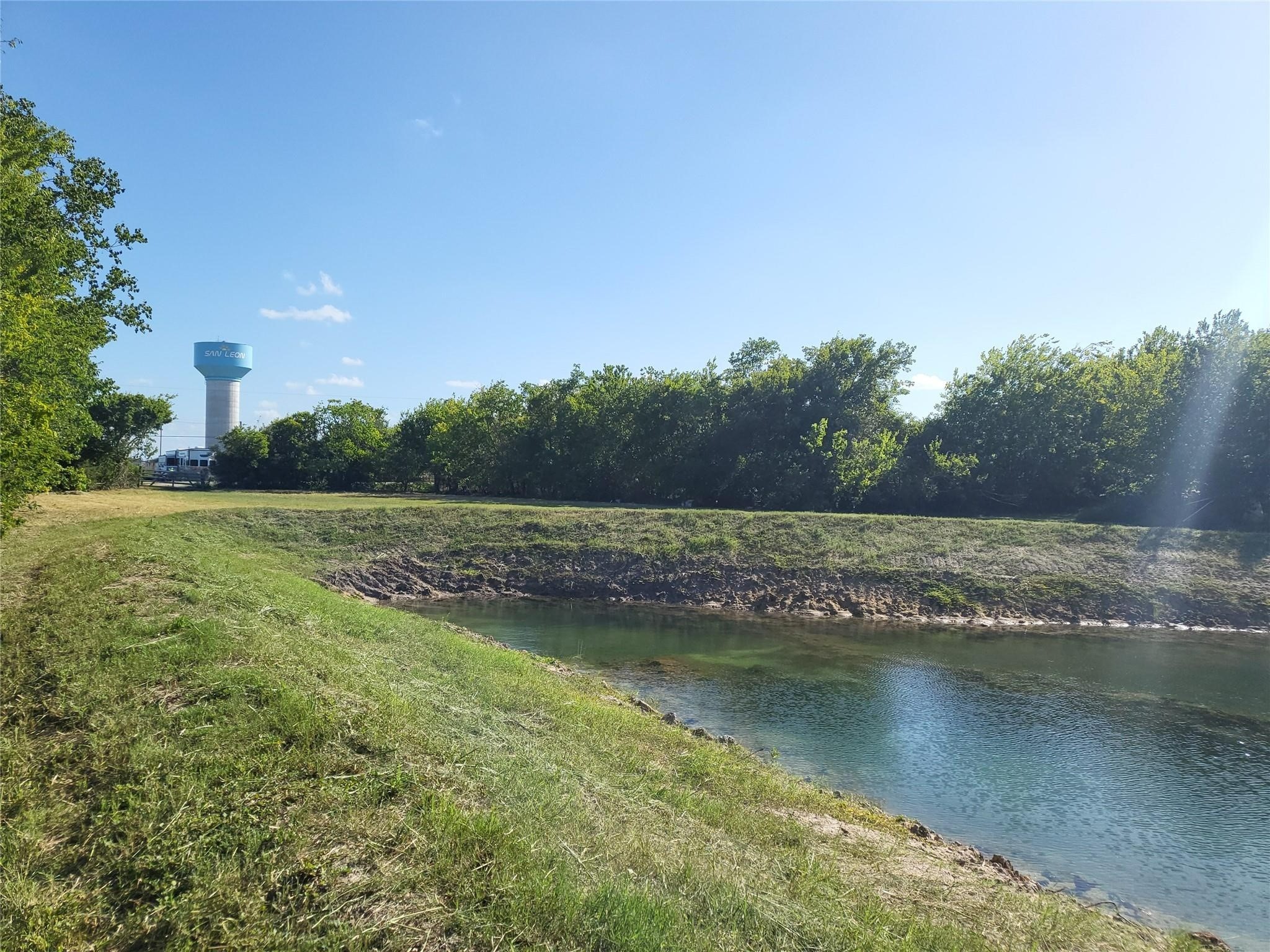 333 24th Street San Leon, TX 77539 - Photo 11 of 36 a view of a lake with a yard