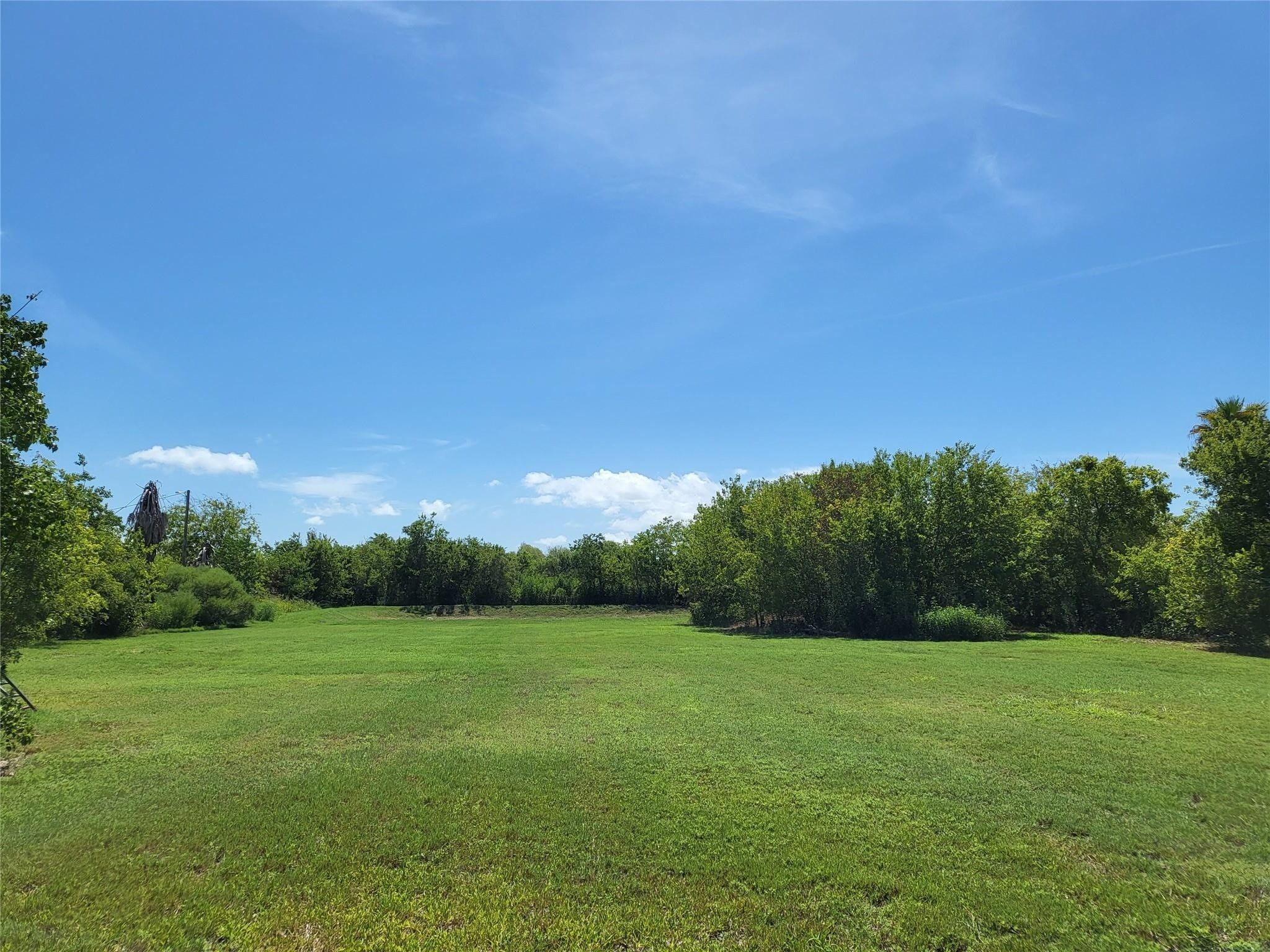 333 24th Street San Leon, TX 77539 - Photo 2 of 36 a view of a grassy field