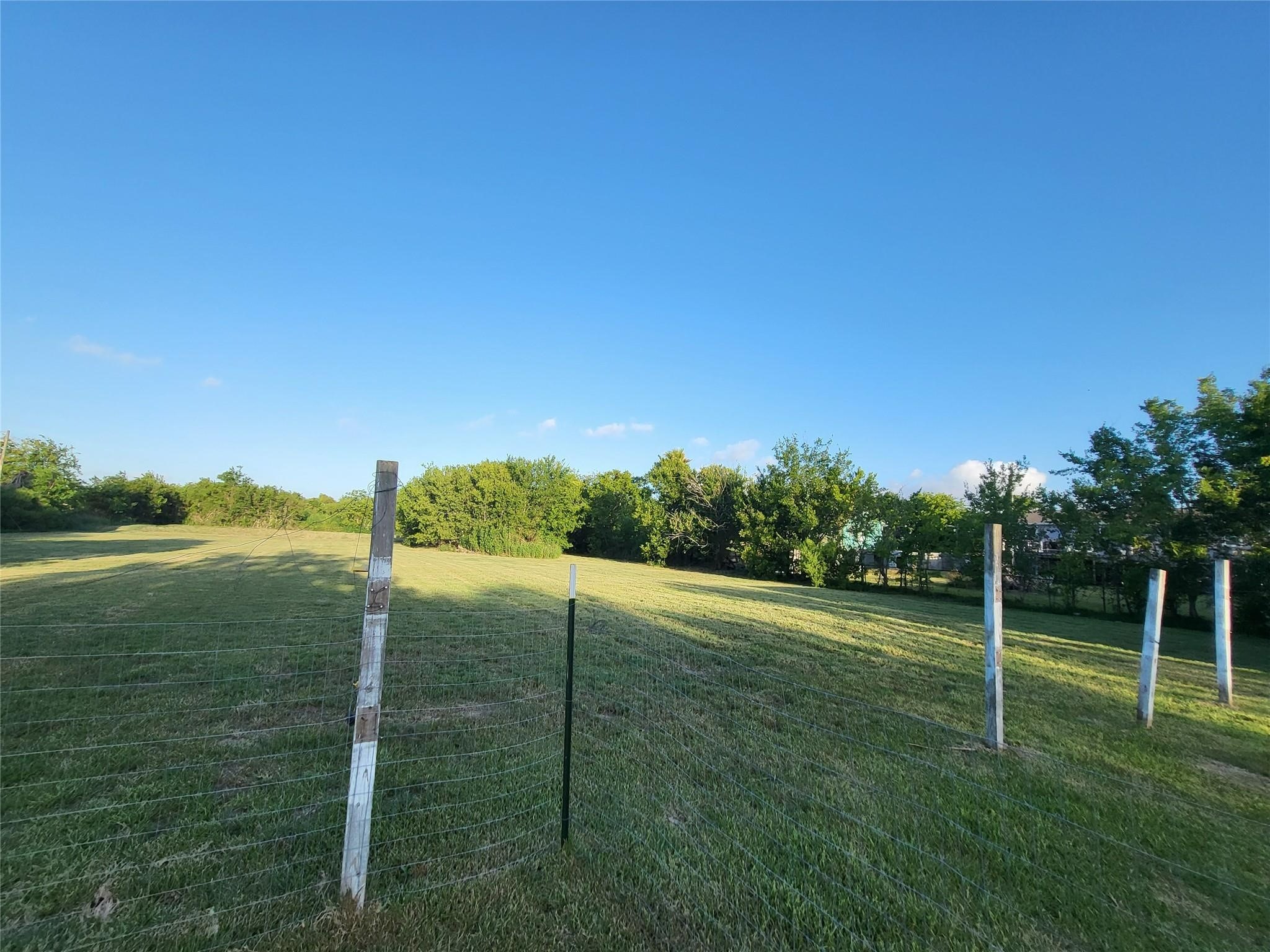 333 24th Street San Leon, TX 77539 - Photo 29 of 36 a view of a green field with clear sky view