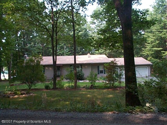 6147 Rr 6 Carter Road Montrose, PA 18801 - Photo 13 of 13 a front view of a house with garden