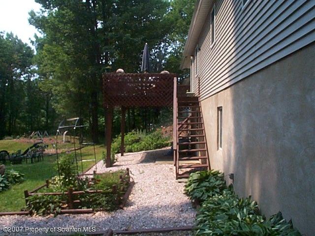 6147 Rr 6 Carter Road Montrose, PA 18801 - Photo 3 of 13 a view of a house with a yard and plants
