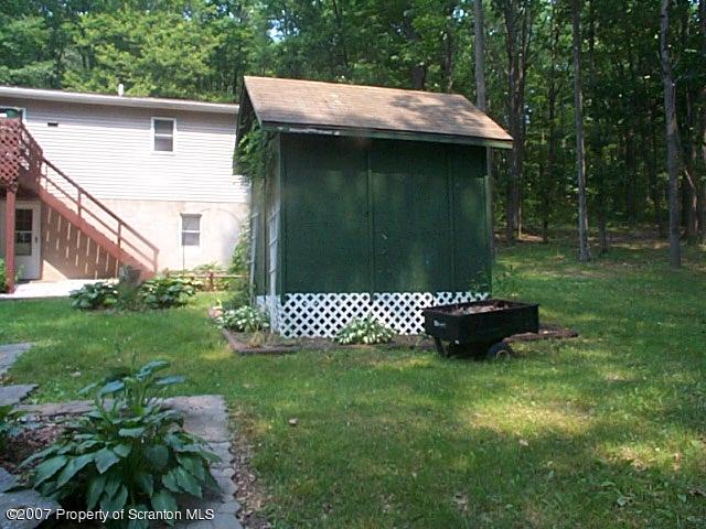 6147 Rr 6 Carter Road Montrose, PA 18801 - Photo 4 of 13 a view of a tiny house with a yard