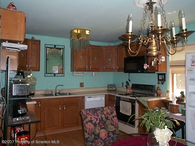 6147 Rr 6 Carter Road Montrose, PA 18801 - Photo 5 of 13 a kitchen with a sink and cabinets