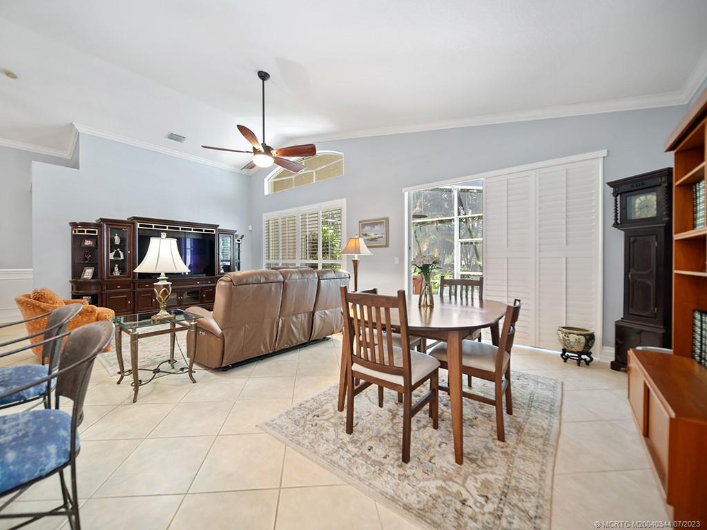 1136 Southeast Westminster Place Stuart, FL 34997 - Photo 12 of 36 a view of a dining room with furniture