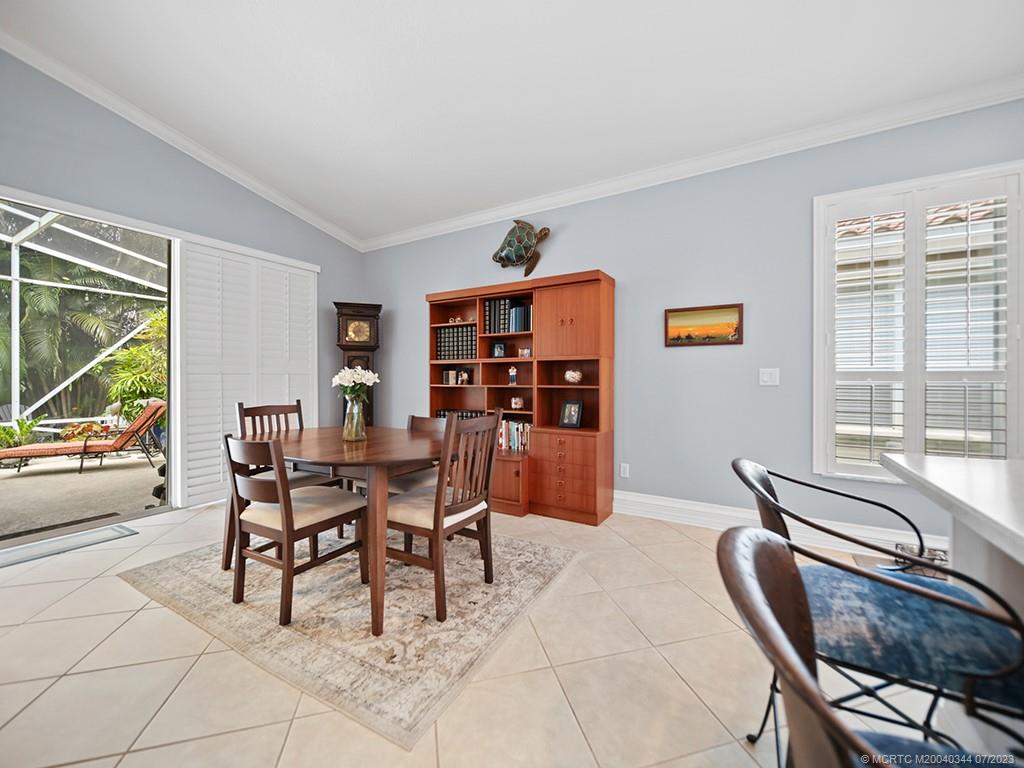 1136 Southeast Westminster Place Stuart, FL 34997 - Photo 15 of 36 a dining room with furniture and window