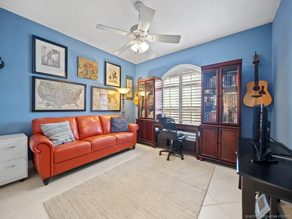 1136 Southeast Westminster Place Stuart, FL 34997 - Photo 19 of 36 a living room with furniture and a window