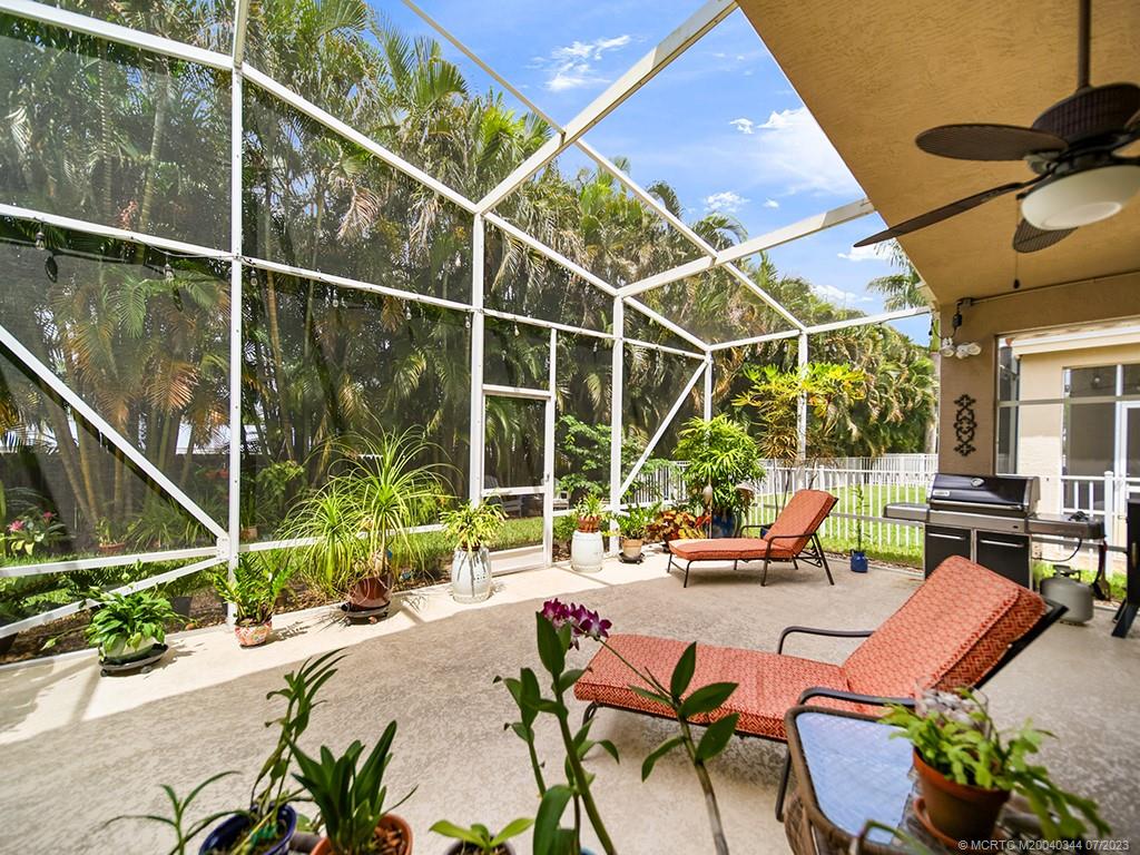 1136 Southeast Westminster Place Stuart, FL 34997 - Photo 28 of 36 a view of swimming pool with outdoor seating and yard in the back