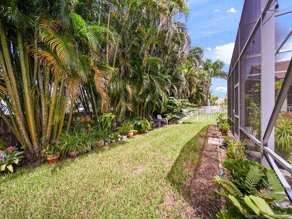 1136 Southeast Westminster Place Stuart, FL 34997 - Photo 31 of 36 a view of a yard with plants