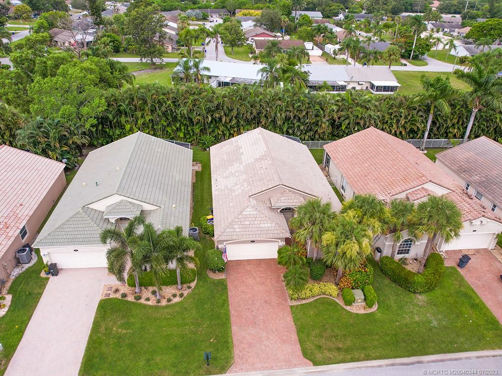 1136 Southeast Westminster Place Stuart, FL 34997 - Photo 4 of 36 an aerial view of a house with yard swimming pool and outdoor seating
