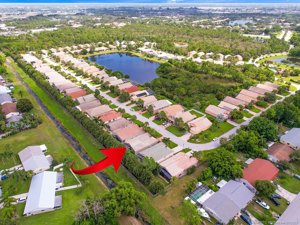 1136 Southeast Westminster Place Stuart, FL 34997 - Photo 5 of 36 an aerial view of residential houses with outdoor space