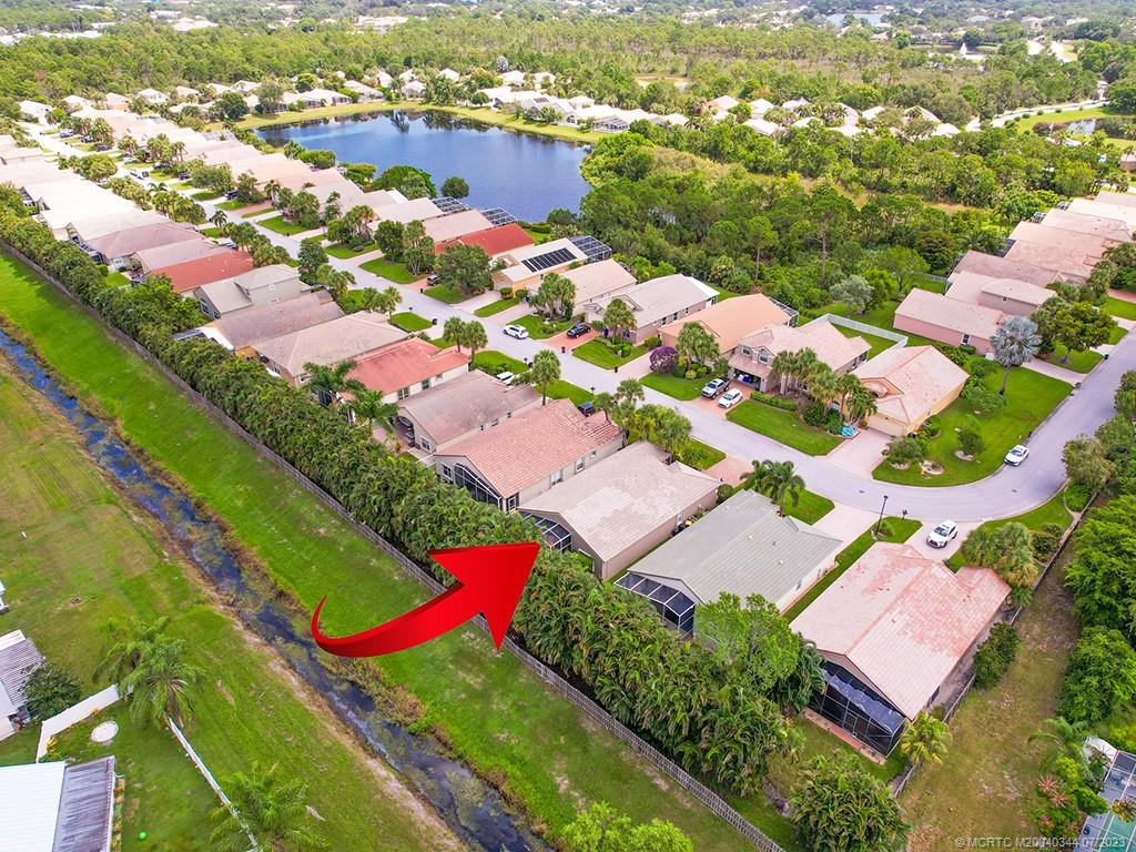 1136 Southeast Westminster Place Stuart, FL 34997 - Photo 6 of 36 an aerial view of residential houses with outdoor space