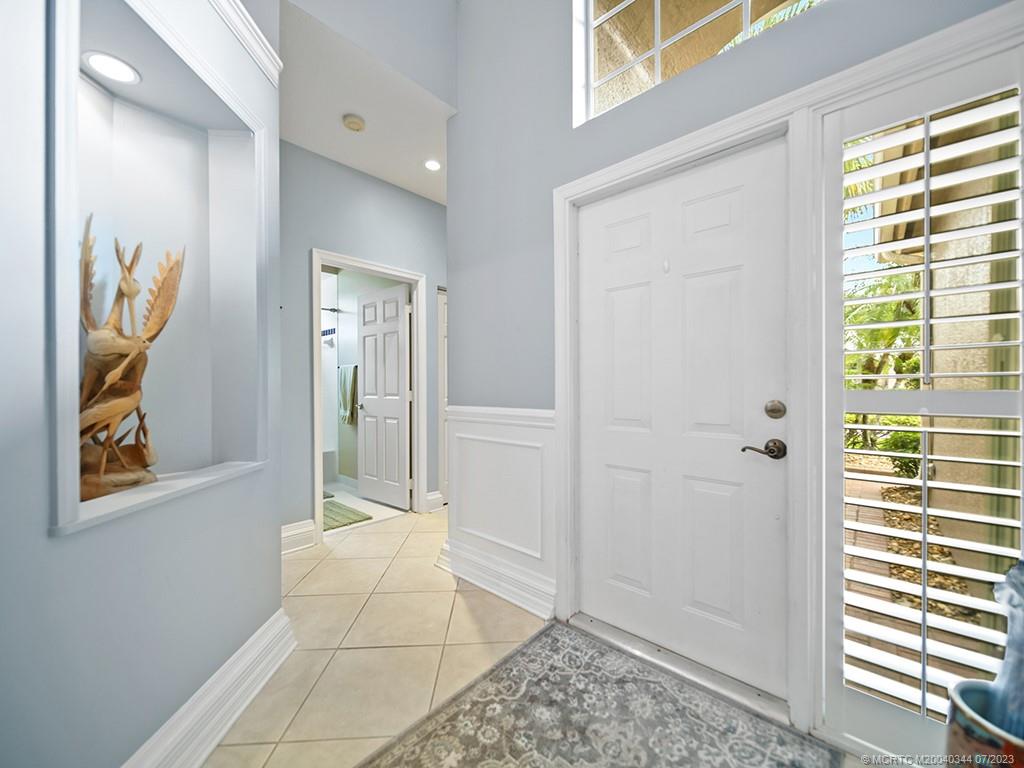 1136 Southeast Westminster Place Stuart, FL 34997 - Photo 8 of 36 a view of an empty room and window