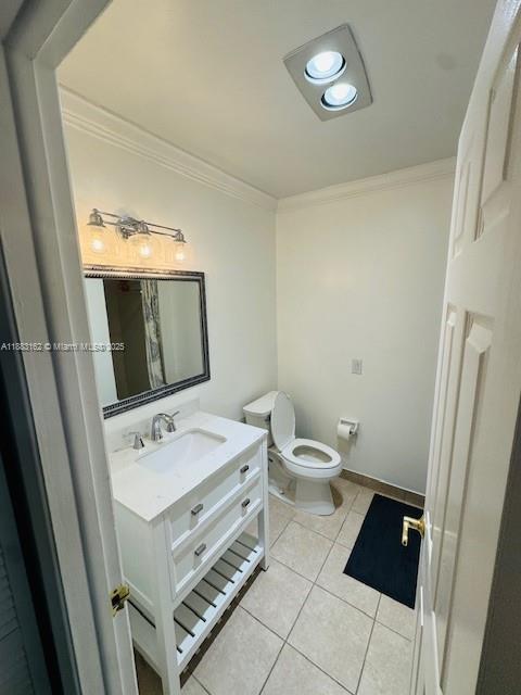 3356 Northeast 33rd Street, Unit 6 Fort Lauderdale, FL 33308 - Photo 11 of 21 a bathroom with a sink a toilet and mirror
