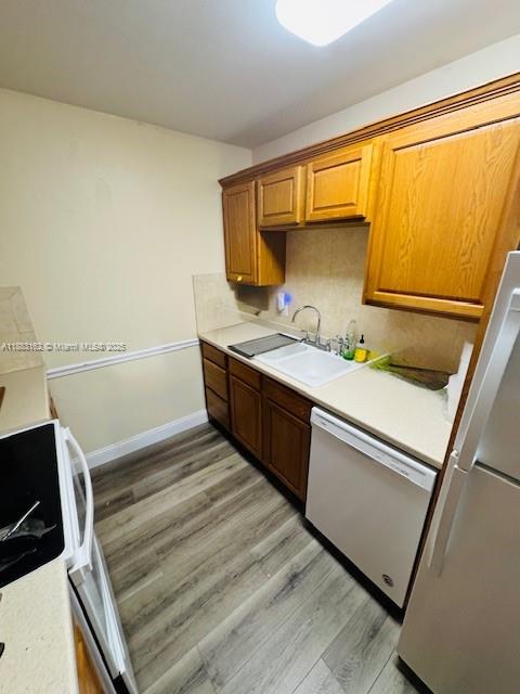 3356 Northeast 33rd Street, Unit 6 Fort Lauderdale, FL 33308 - Photo 13 of 21 a kitchen with a sink and a stove top oven