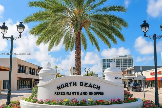 a sign on a pole on a street