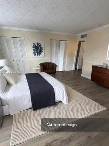 a bedroom with a large bed and a couch