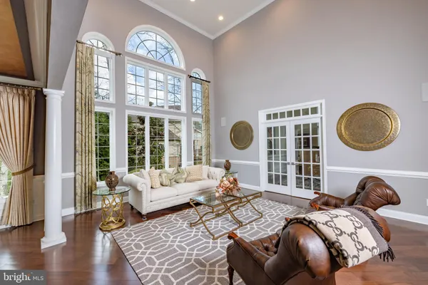 a bedroom with bed and a large window