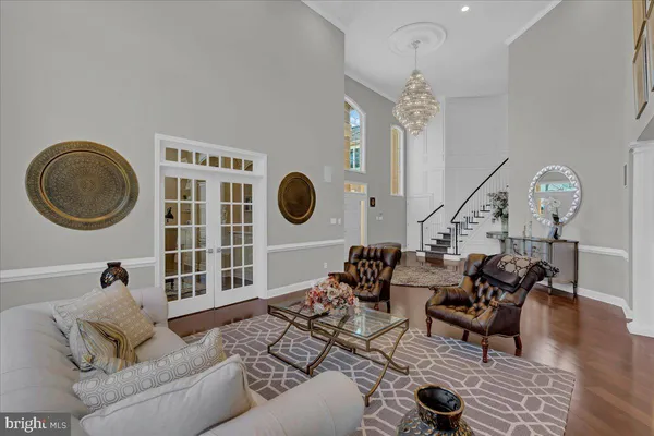 a living room with furniture and a mirror