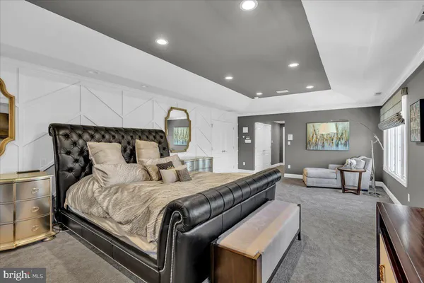 a bedroom with bed and window