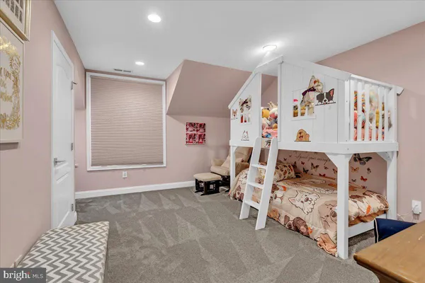 a bedroom with furniture and white walls