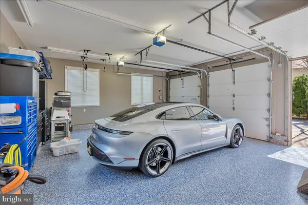 a car and bike parked in a garage
