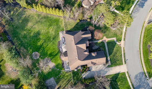 an aerial view of a house with yard swimming pool and outdoor seating