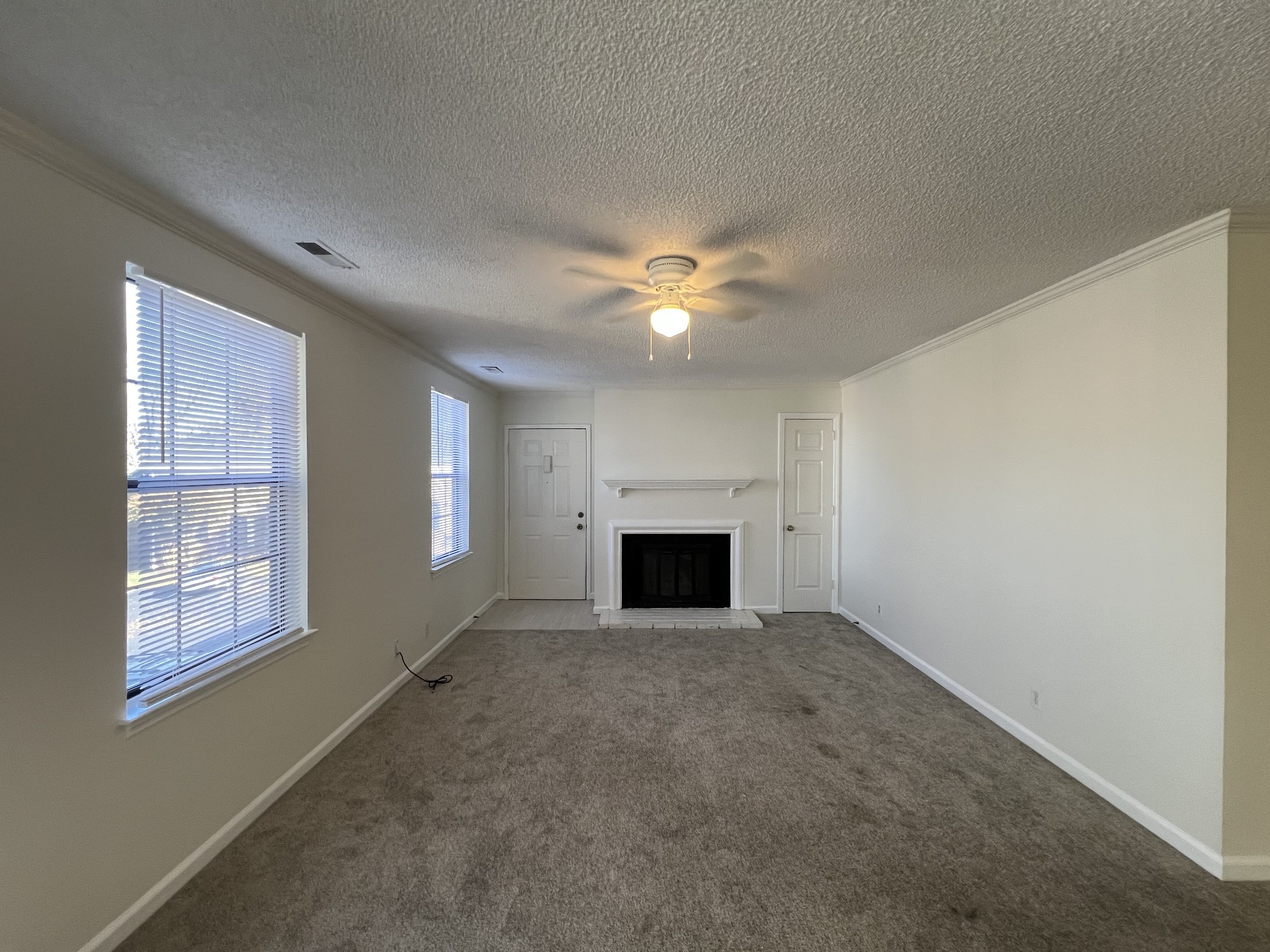 764 Fox Ridge Drive Brentwood, TN 37027 - Photo 3 of 12 an empty room with windows and fireplace