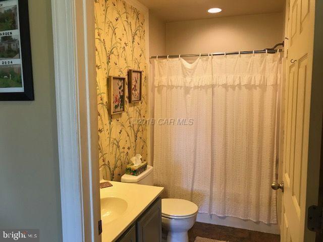 2700 Elsey Road Nanticoke, MD 21840 - Photo 22 of 43 a bathroom with a shower curtain and a sink
