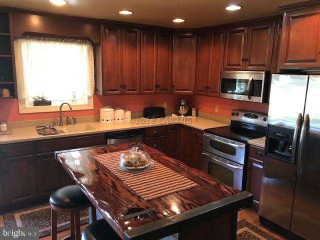 2700 Elsey Road Nanticoke, MD 21840 - Photo 7 of 43 a kitchen with a sink stove and cabinets