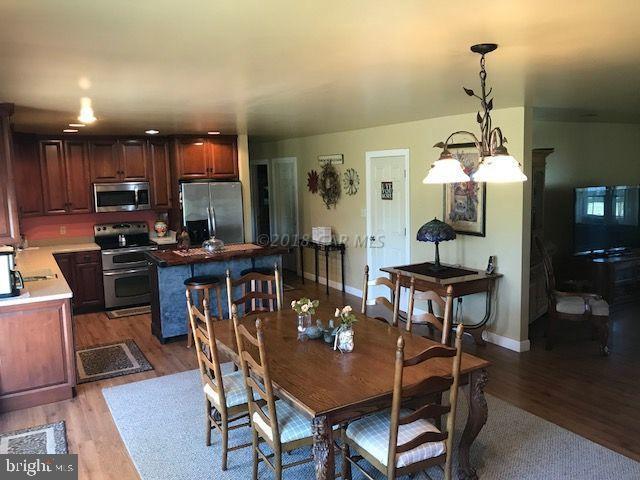 2700 Elsey Road Nanticoke, MD 21840 - Photo 9 of 43 a view of a dining room with furniture and wooden floor