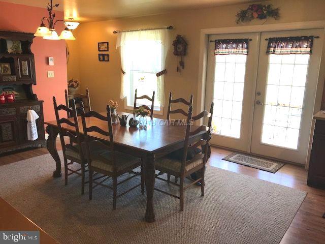 2700 Elsey Road Nanticoke, MD 21840 - Photo 10 of 43 a view of a dining room with furniture and chandelier
