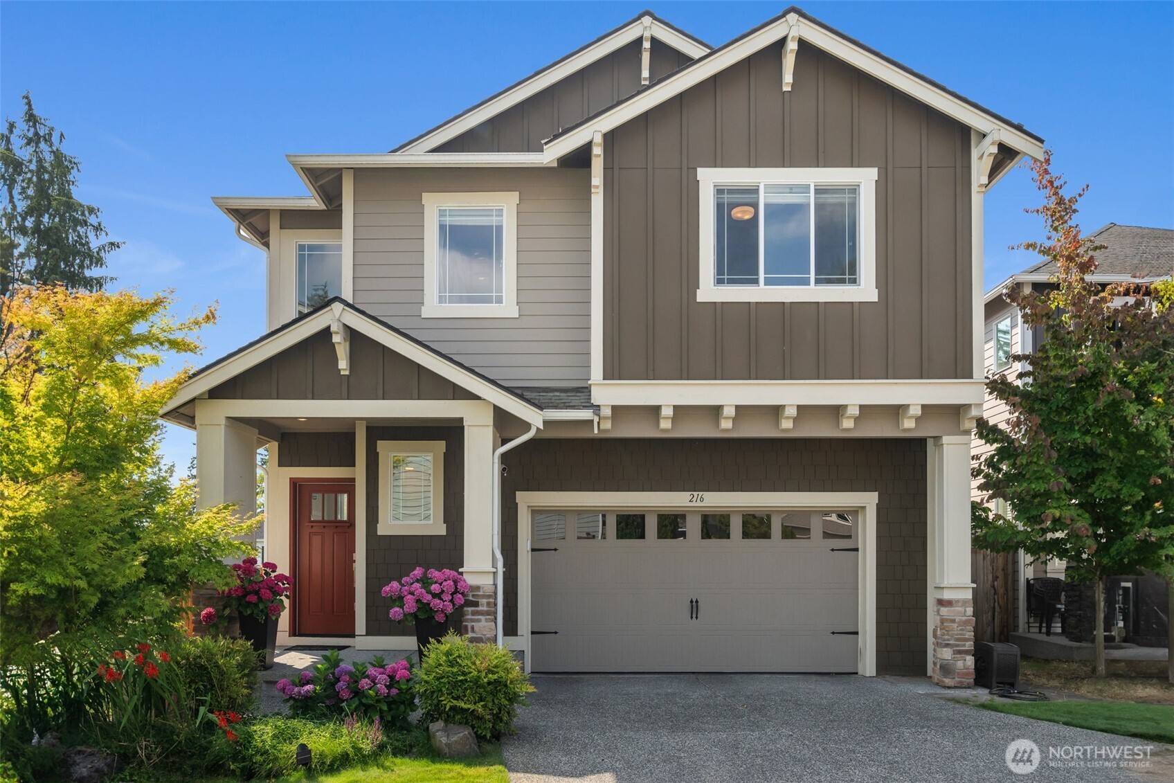 216 178th Street Southeast Bothell, WA 98012 - Photo 3 of 40 a front view of a house with yard