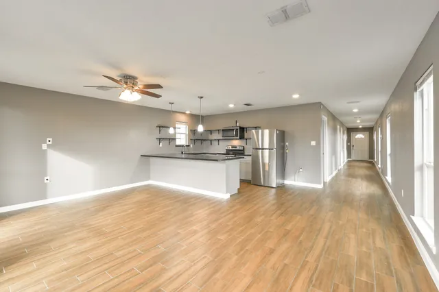 a view of kitchen with cabinets