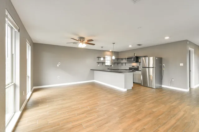 a view of kitchen with wooden floor