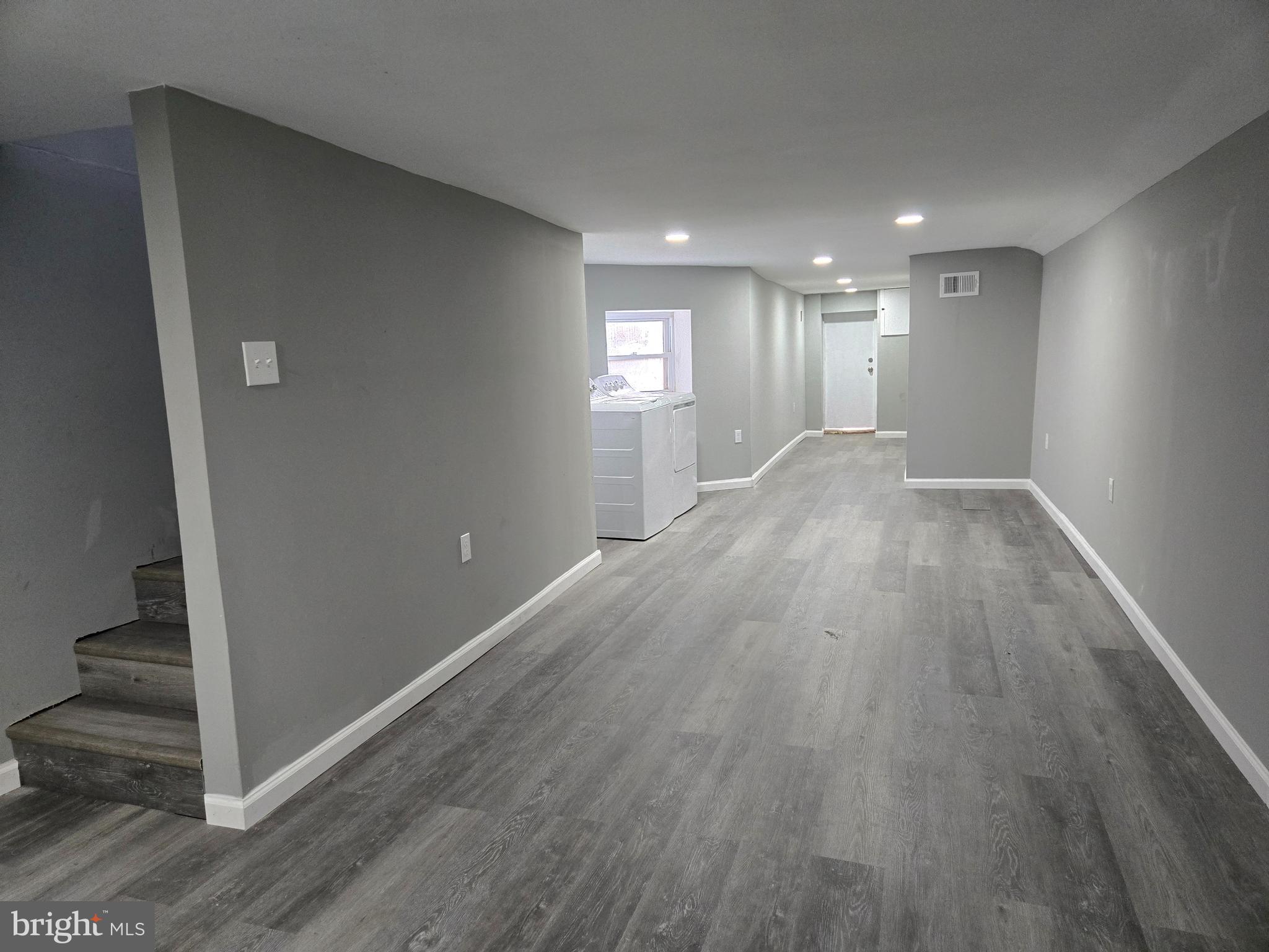 2811 East Preston Street Baltimore, MD 21213 - Photo 11 of 28 a view of a hallway with wooden floor