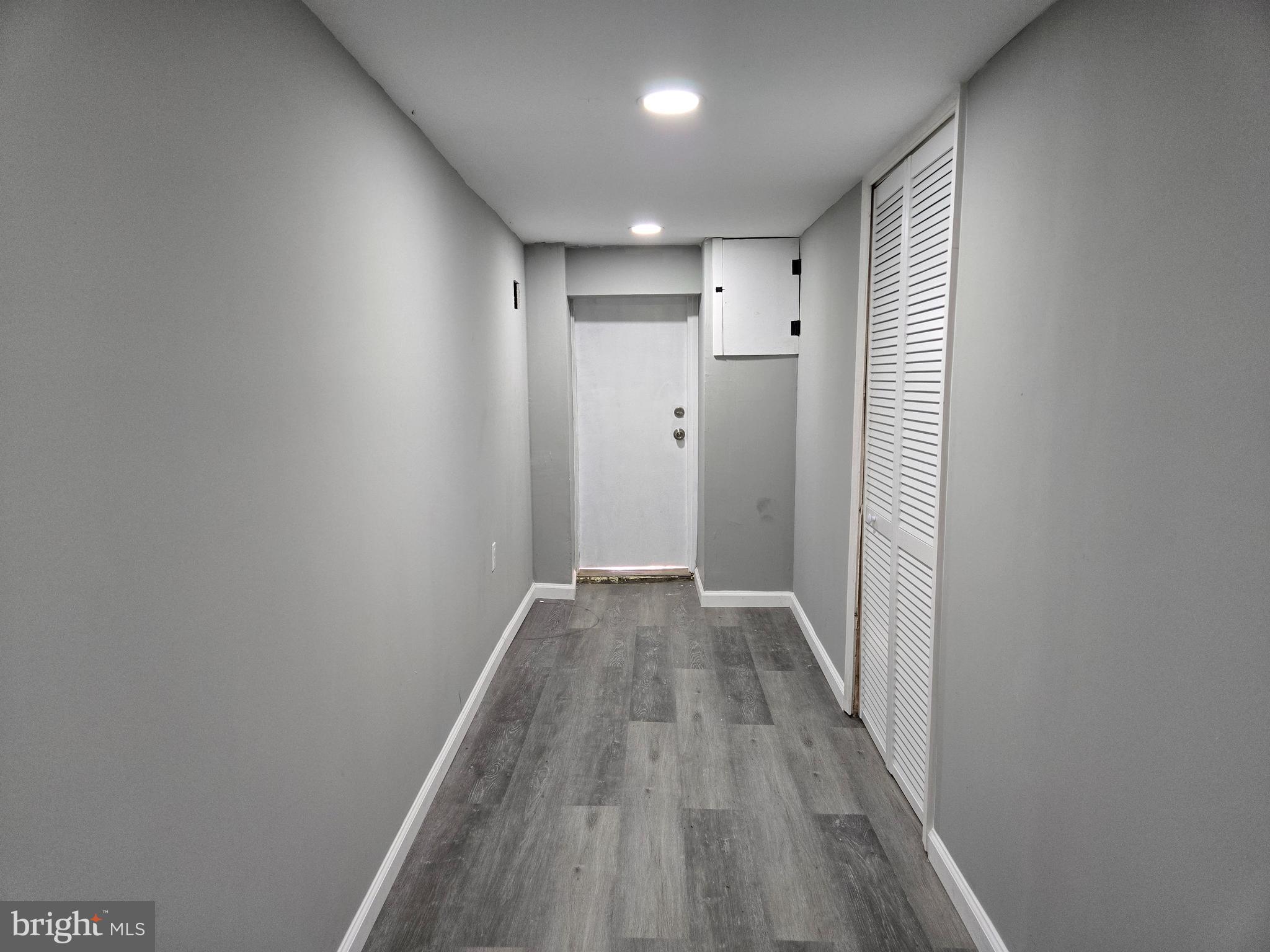 2811 East Preston Street Baltimore, MD 21213 - Photo 26 of 28 a view of a hallway with wooden floor