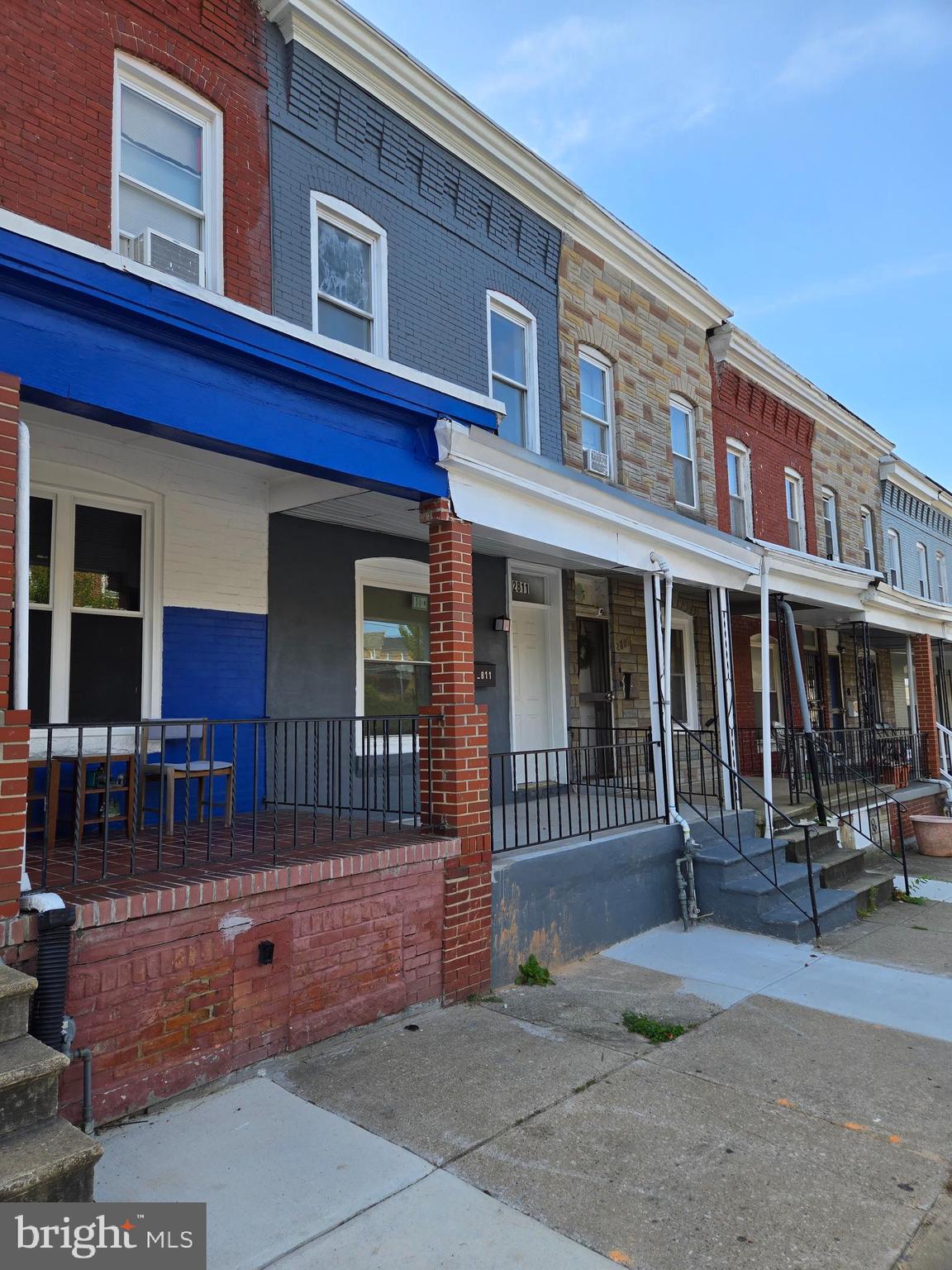2811 East Preston Street Baltimore, MD 21213 - Photo 4 of 28 a front view of a building with outdoor seating