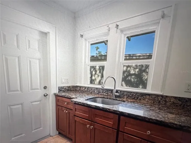 a kitchen with a stove and a refrigerator