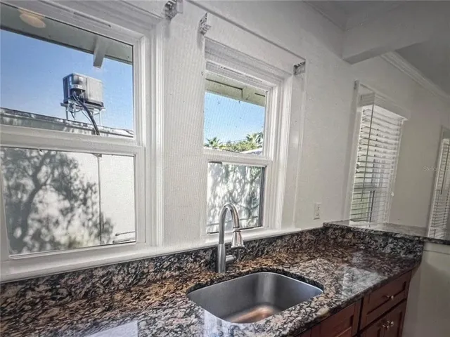 a kitchen with a stove and a microwave