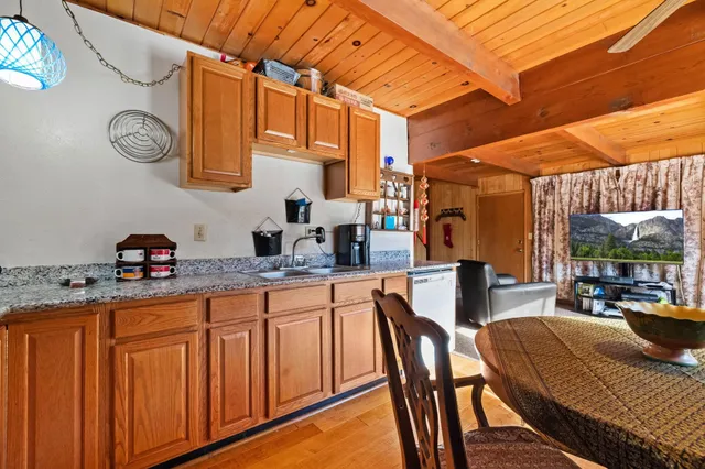 a dining room with furniture and a window