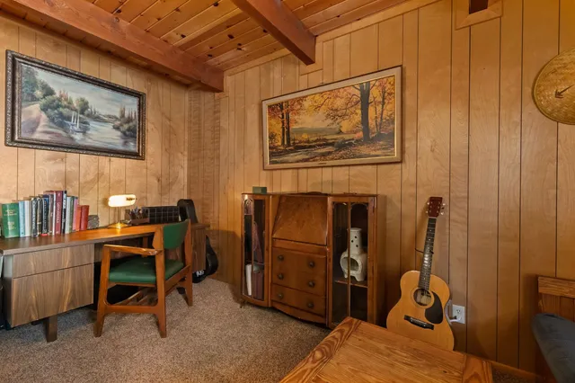 a view of a workspace with furniture