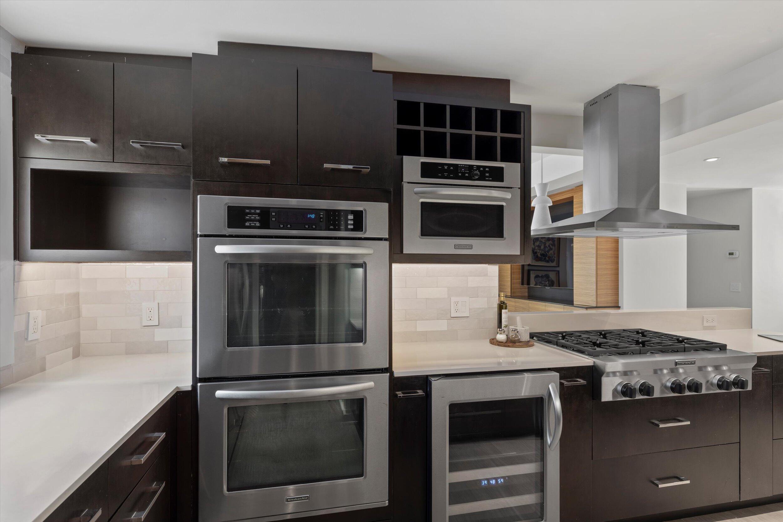 1501 Florida Street Key West, FL 33040 - Photo 30 of 70 a kitchen with granite countertop a stove and a microwave