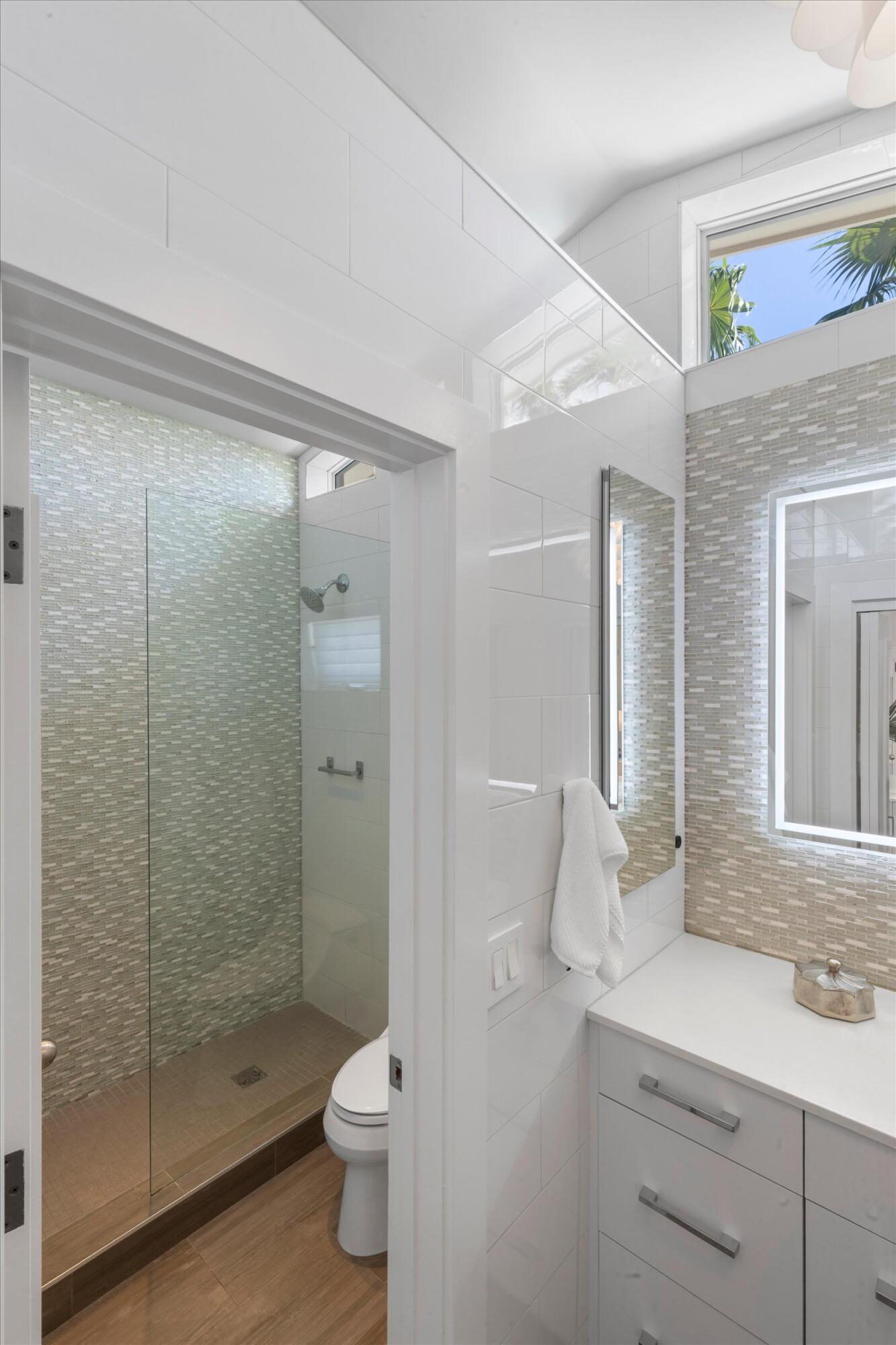 1501 Florida Street Key West, FL 33040 - Photo 56 of 70 a bathroom with a shower sink vanity mirror and toilet