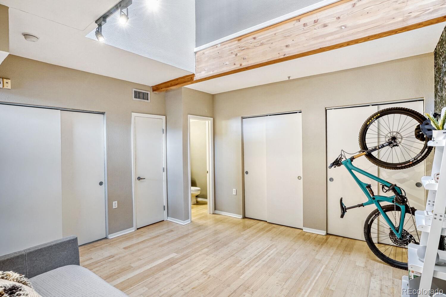 3295 Blake Street, Unit 202 Denver, CO 80205 - Photo 17 of 39 a view of an entryway with wooden floor