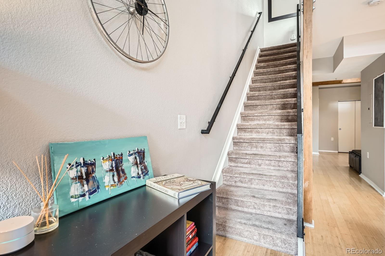 3295 Blake Street, Unit 202 Denver, CO 80205 - Photo 23 of 39 a view of a hallway with seating area