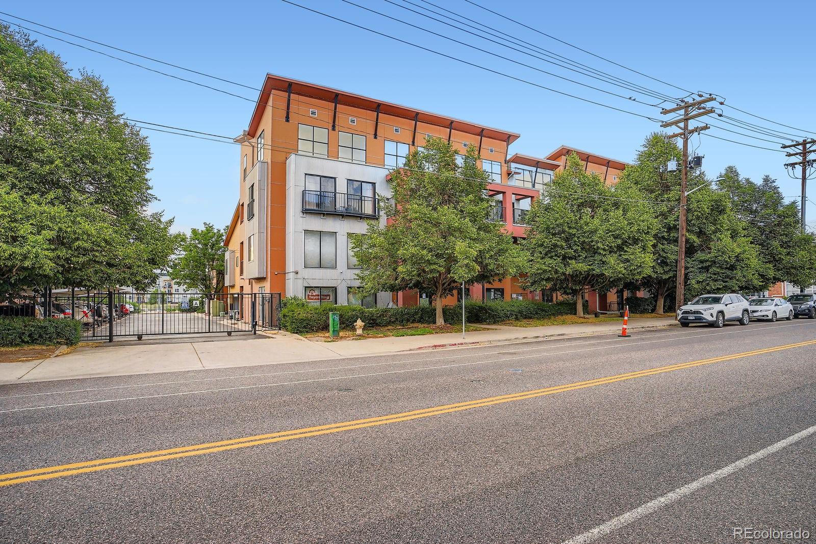 3295 Blake Street, Unit 202 Denver, CO 80205 - Photo 28 of 39 a view of a tall buildings in a street