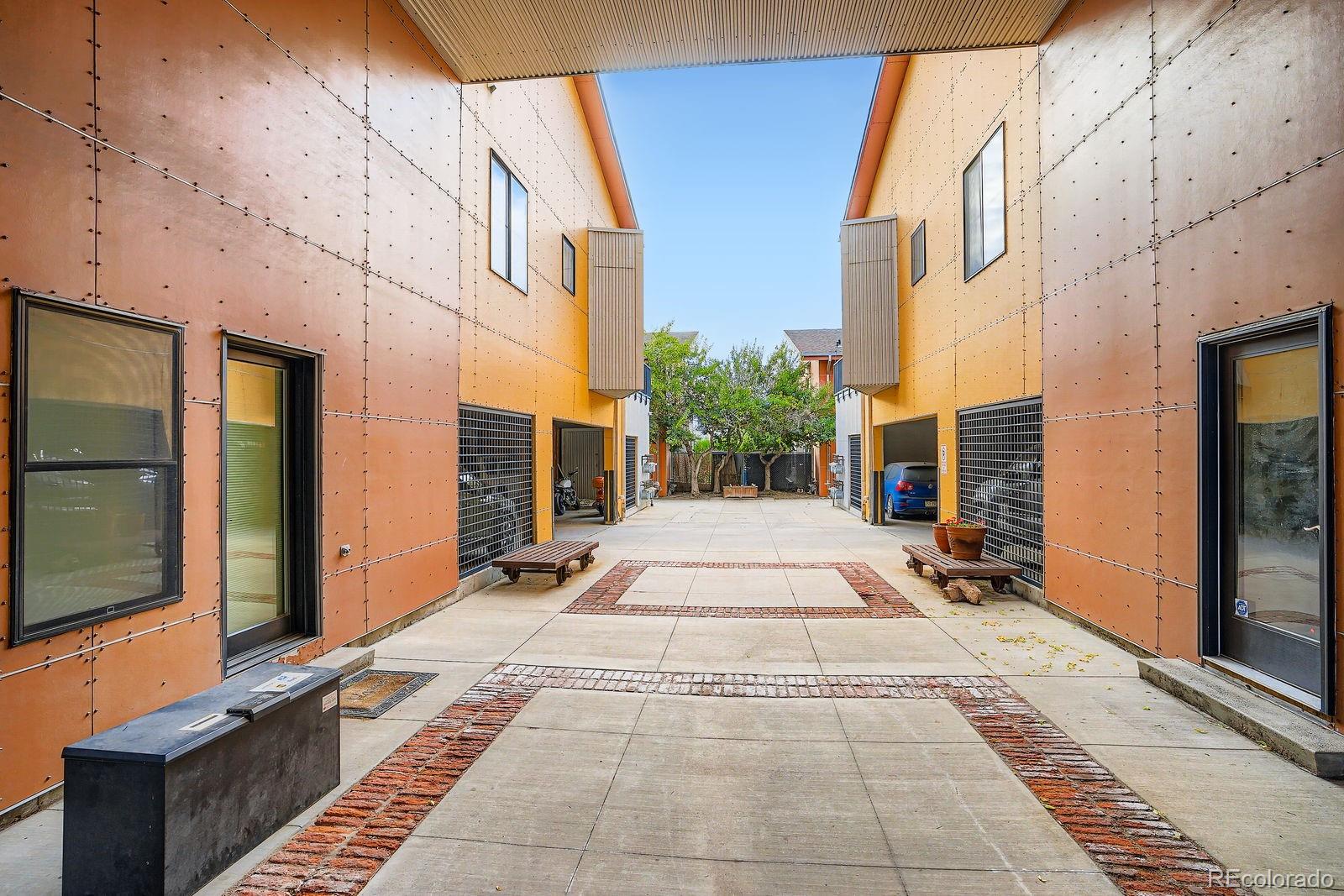 3295 Blake Street, Unit 202 Denver, CO 80205 - Photo 5 of 39 a view of a building with many windows