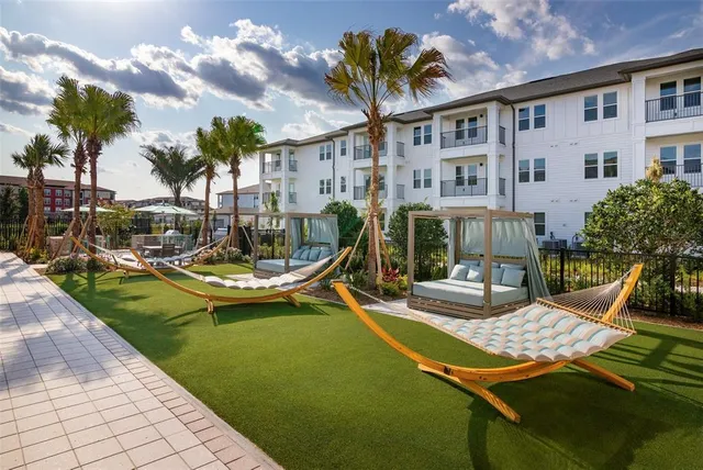 a view of a patio with swimming pool table and chairs